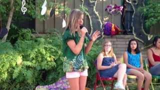 Liv Nelson sings for a small group at end of summer