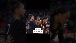 A’ja Wilson held back by teammates and Becky Hammon after being shoved 