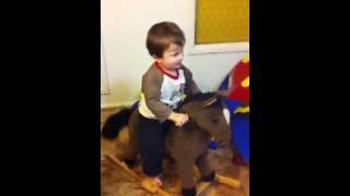Cash riding a rocking horse