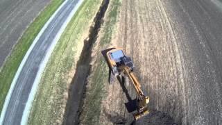 Drone view - Excavator cleaning a drainage ditch in NE IL