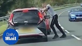 Road rage driver tailgates car before angrily confronting motorist