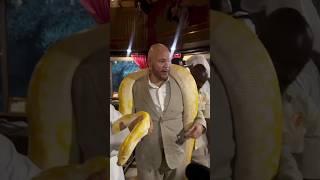 FATJOE HOLDING A PYTHON.......