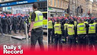 Rangers fans in Santa hats kettled on Union Street before Scottish League Cup Final against Celtic