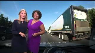 Eileen Whelan helps Julie Wright deliver the traffic report