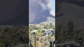 Firefighters battle raging brush fire in Los Angeles