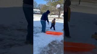 Here, hold my beer - Playing in the snow with one of the Grandsons