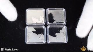 Four silver coins - one Canadian Maple Leaf...