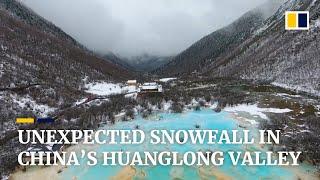 Unexpected snowfall blankets China’s Huanglong valley