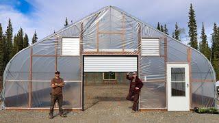 Completing Our Alaska Sized Greenhouse – Plastic Cover, Installing Doors & Roll-up Sides