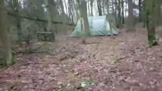 Hiding a big tent in the forest.