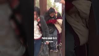 CAUGHT ON CAM: Human smuggler leads migrants through a hole they cut in the southern border wall