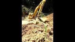 Dumb Trinidad excavator driver stuck in river