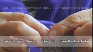 Woman knits sweater knitting needles