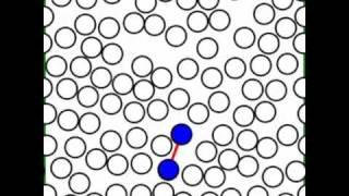 Isomerization of a Double-Well Diatomic in a 2D WCA Fluid