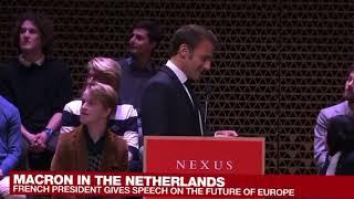 Macron interrupted by protesters as he began speaking in the Nexus Institute in The Hague.