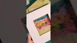 Colourful needle felt artwork using scraps of yarn, wool, fabric and thread.