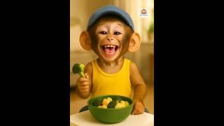 baby monkey eating broccoli 