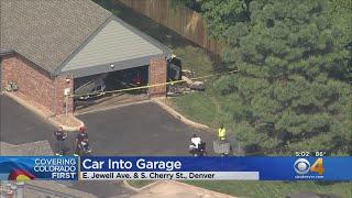 Vehicle Crashes Through Garage