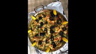 Traditional Paella recipe cooked using a 16 inch Paella pan over a fire pit.