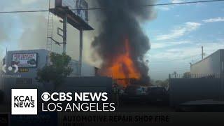 Firefighters contain blaze at auto repair shop in Van Nuys