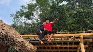 Single mother and policeman happy together, completing small kitchen together