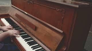 Cras Numquam Scire on a Young Chang Upright Piano in Walnut Cabinetry With an Elegant Carved Pattern