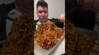 Eating Spicy Black Bean Noodles 