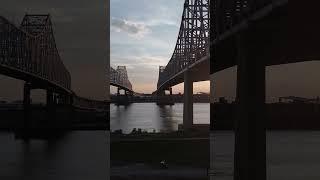 Mississippi River bridges, called Crescent City Connection, in New Orleans at sunset. #neworleans