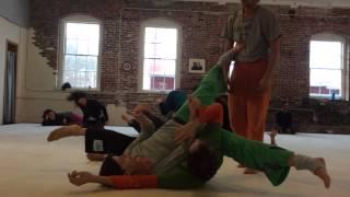 Contact improvisation Trio in Dojo. Dancers Alex Guex, Anna Titova and Frederic Holzwarth
