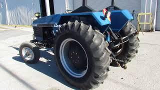 Long 2460 Tractor | Compass Auctions & Real Estate