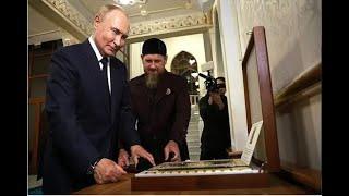 Putin kisses the Quran at the Jesus Chechen mosque