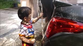 Alex Prin Braun washed car with papa babbling around. (2 years 7 months old)