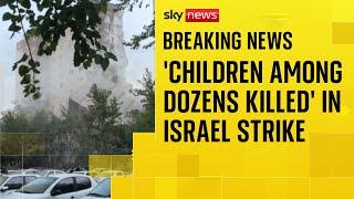 Iran state TV: Around 60 people killed in strike on housing complex, including 20 children