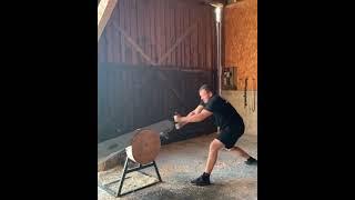 Guy saws huge log with a massive saw