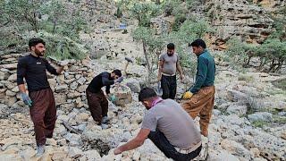 Empathy in the heart of the mountains: Ali and Issa help a neighbor build a toilet