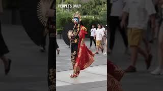 A street artist performs Bian Lian, ace-changing, art
