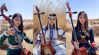 【Traveling in Mongolia】 Mongolian girl Mongolian girl plays the national musical instrument matouqin