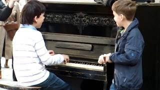 Piano prodigy kid performing on "Session street" in Lviv