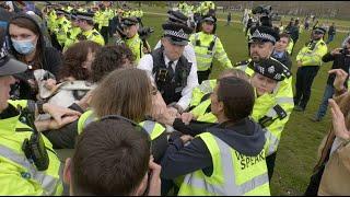 Transgender activists face off with police at Posie Parker's London rally