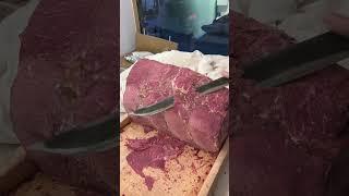 The beef looks delicious when cut with a big knife