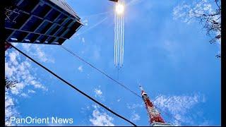 Japan's Blue Impulse jets Olympic Rings in Tokyo sky