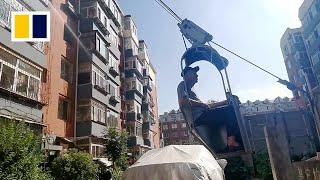 Tired of stairs, Chinese man builds DIY lift but is later forced to remove it
