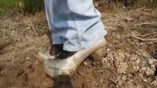 Gold High heels in mud