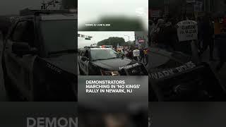Demonstrators marching in 'No Kings' rally in Newark, NJ