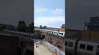 Delivery driver throw bottles of water to people stuck on train in London