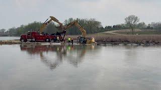 Excavator gets stuck in Yahara River