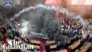 Flares and teargas thrown in Serbia's parliament amid protests