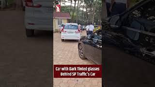 Car with Dark Tinted glasses Behind SP Traffic's Car