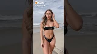another beautiful girl in a black micro bikini