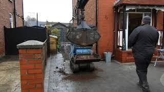 Hiab dropping soil into a micro dumper